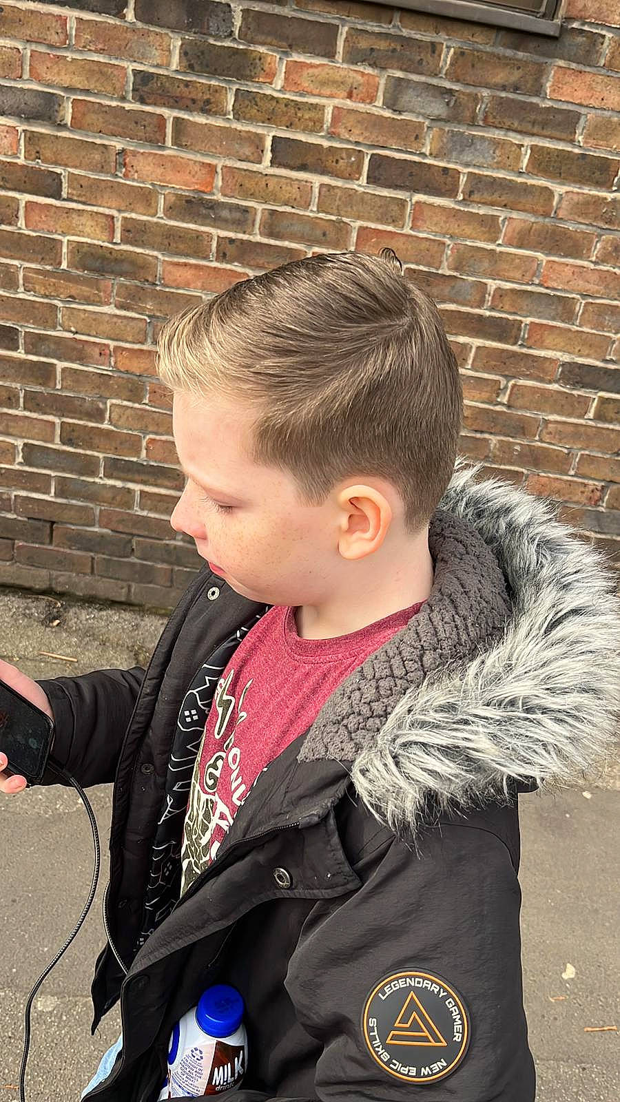 Harvey joined the competition — help win amazing prizes! brick, brickwork, buzz_cut, caesar_cut, child, crew_cut, electric_blue, fur, jacket, leather, military_camouflage, military_uniform, official, outerwear, pattern, person, personal_protective_equipment, sleeve, t_shirt, tree