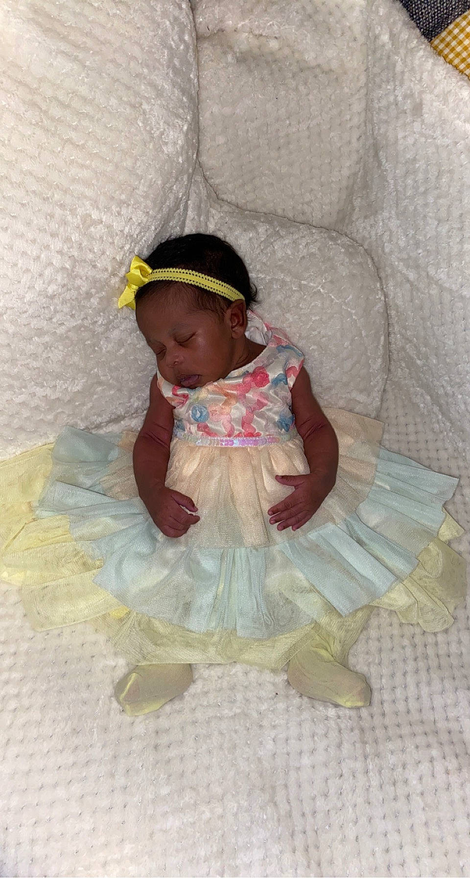 Kensley is registered to the contest to win money with this photo: baby, baby_products, baby_toddler_clothing, cap, child, comfort, fashion_accessory, headpiece, linens, magenta, pattern, peach, person, pink, room, ruffle, sitting, sleeve, sock, textile