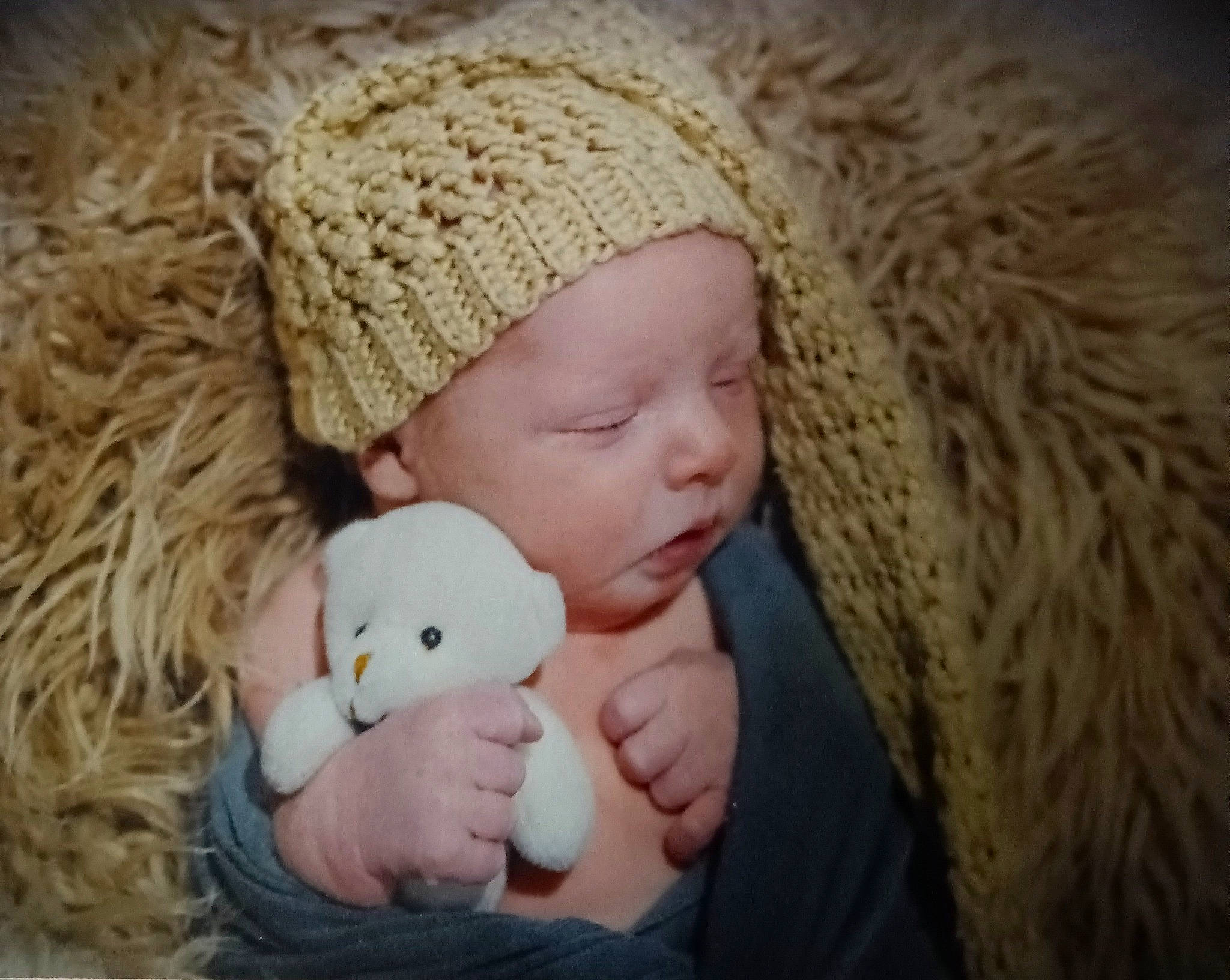 Chase is registered to the contest to win money with this photo: baby, baby_sleeping, baby_toddler_clothing, cap, cheek, child, comfort, eye, face, happy, hat, headgear, headwear, knit_cap, mammal, person, skin, textile, toddler, toy