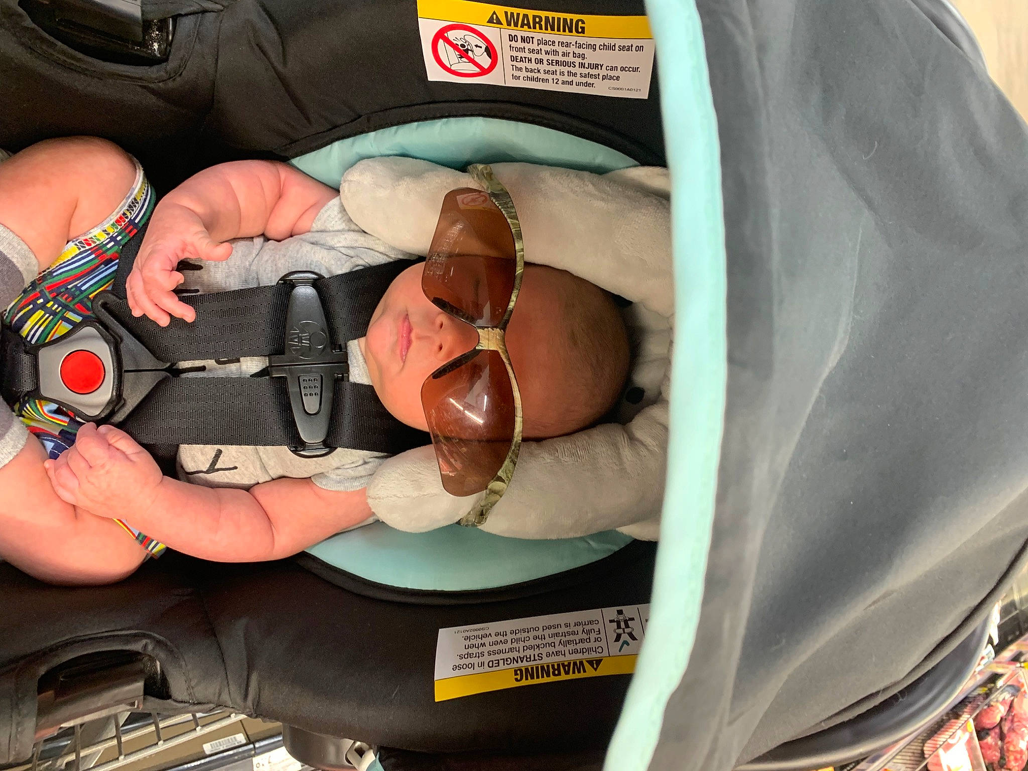 Isaac is registered to the contest to win money with this photo: baby, baby_products, baby_safety, car_seat, child, comfort, eyewear, finger, hand, health_care, infant_bed, lap, nail, person, personal_protective_equipment, product, sitting, thigh, thumb, toddler
