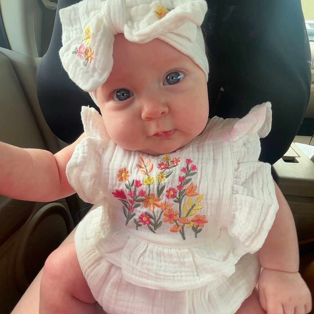 Oakleyy joined the competition — help win amazing prizes! baby, bow, car_interior, car_seat, casual, child, chubby, cute, face, floral_embroidery, hands, headband, indoors, infant, legs, looking, person, portrait, sitting, white_clothing