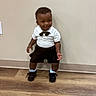 Demonte joined the competition — help win amazing prizes! toddler, child, boy, standing, white_shirt, black_shorts, bow_tie, gold_chain, sneakers, wooden_floor, indoor, wall, cute, fashion, smiling, person, portrait, floor, casual, happy