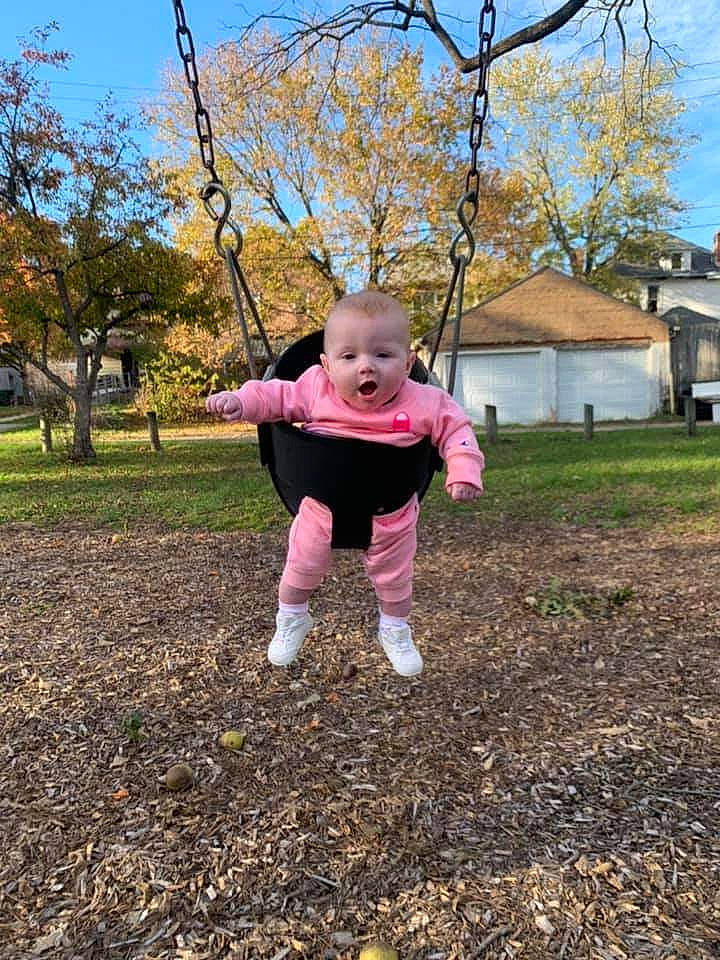Harper joined the competition — help win amazing prizes! baby, baby_toddler_clothing, branch, fun, gesture, grass, hand, happy, human_body, leisure, people_in_nature, person, plant, playground, recreation, sky, sleeve, swing, toddler, tree