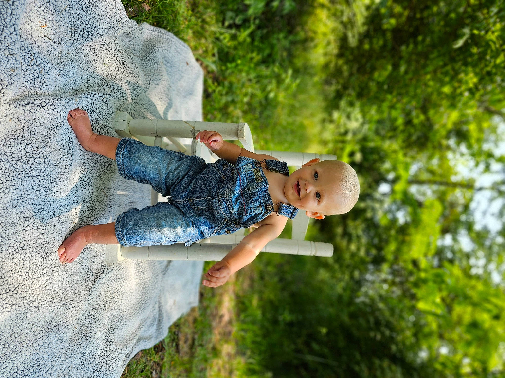Kevin joined the competition — help win amazing prizes! barefoot, child, denim, electric_blue, fun, gesture, grass, hand, happy, joy, landscape, leisure, people_in_nature, person, plant, play, recreation, sitting, t_shirt, toddler