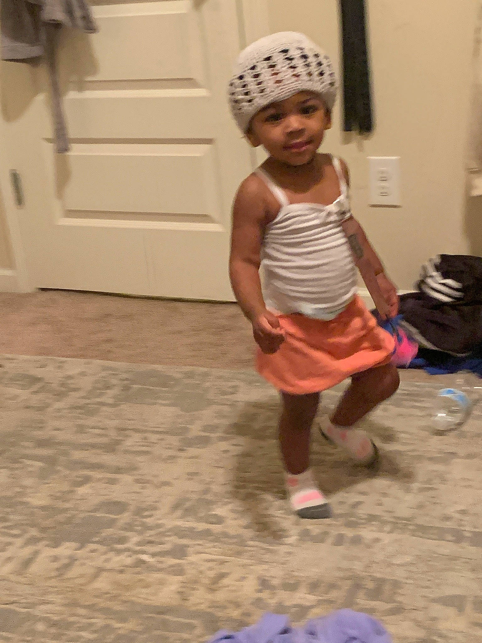 Harmoni is registered to the contest to win money with this photo: backpack, cap, child, event, floor, flooring, fun, happy, headwear, human_leg, leisure, luggage_and_bags, magenta, person, recreation, room, sandal, shorts, smile, t_shirt