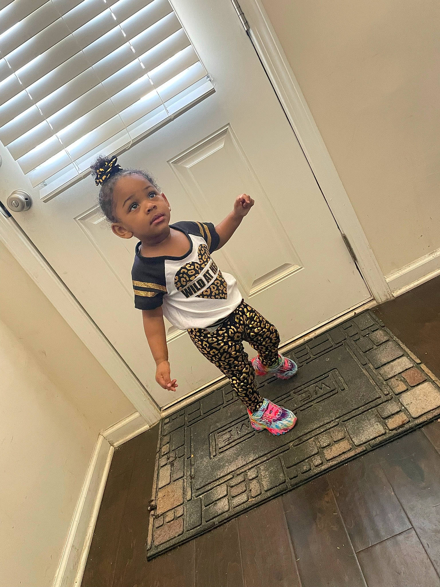 Harmoni joined the competition — help win amazing prizes! baby_toddler_clothing, balance, barefoot, calf, child, floor, flooring, fun, hardwood, human_leg, knee, performing_arts, person, physical_fitness, room, shorts, sportswear, thigh, toddler, waist