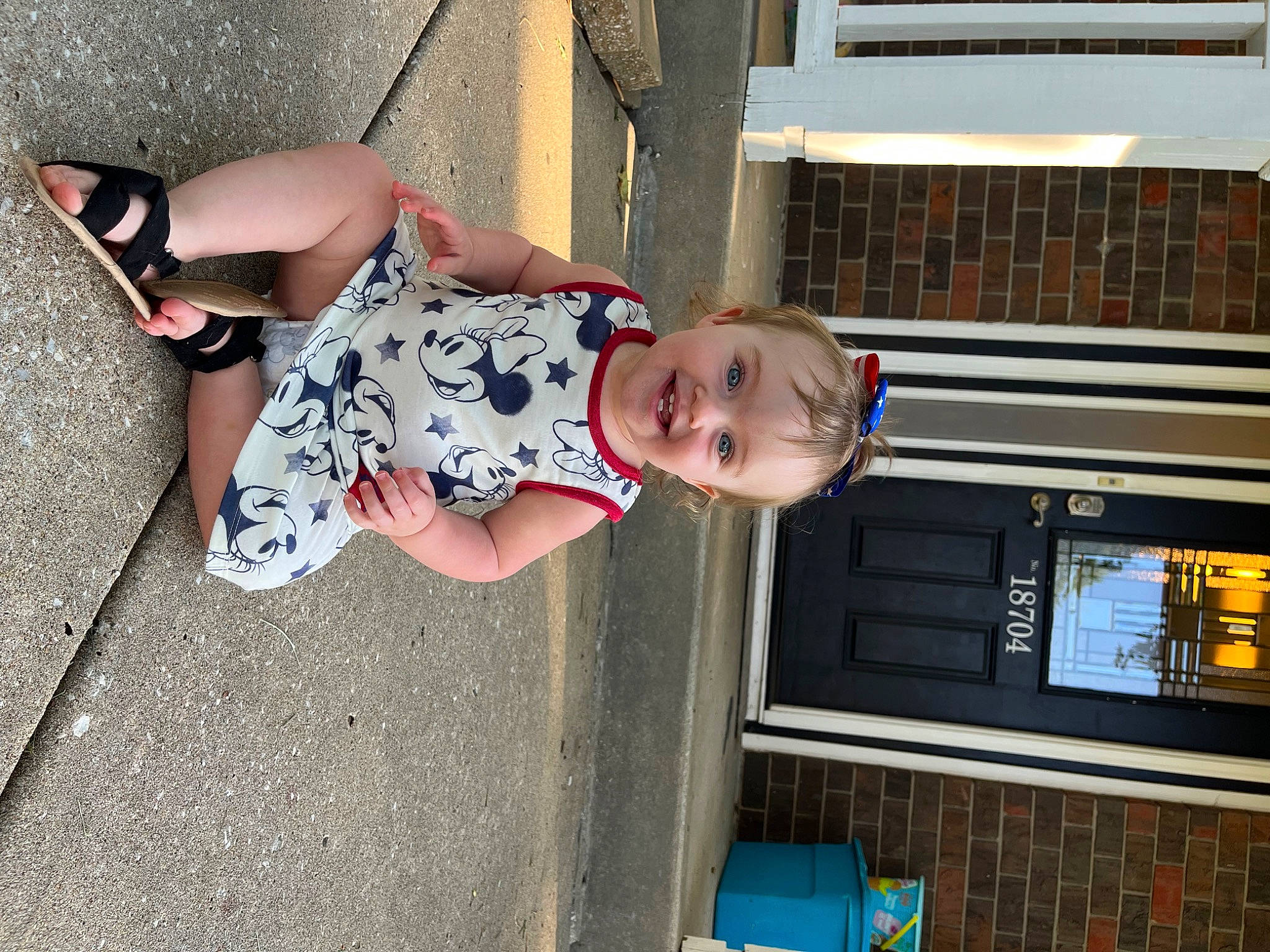 Salia is registered to the contest to win money with this photo: baby, baby_toddler_clothing, blue, calf, child, display_device, eyewear, foot, fun, human_leg, joy, knee, leisure, machine, pattern, person, sandal, sitting, smile, snapshot