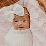 baby, infant, bow, headband, blanket, wicker_basket, pink, white, smile, face, portrait, cute, soft, cozy, newborn, child, wrapped, resting, indoors, person