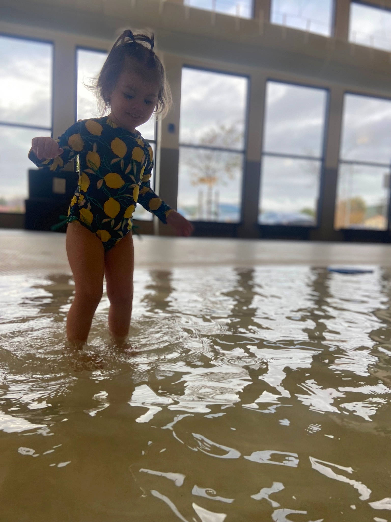 Elizabeth joined the competition — help win amazing prizes! barefoot, body_of_water, child, floor, flooring, fun, happy, human_leg, leisure, pattern, person, personal_protective_equipment, recreation, reflection, sleeve, t_shirt, thigh, toddler, waist, water