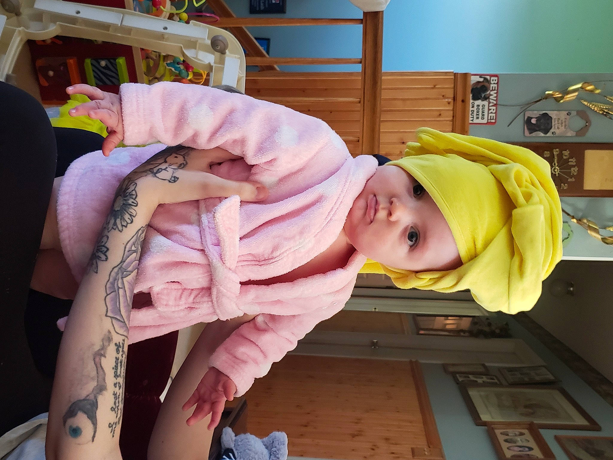 Sophia is registered to the contest to win money with this photo: baby, baby_products, baby_safety, baby_toddler_clothing, child, comfort, flooring, fun, hat, headwear, houseplant, person, picture_frame, room, thigh, toddler, wood