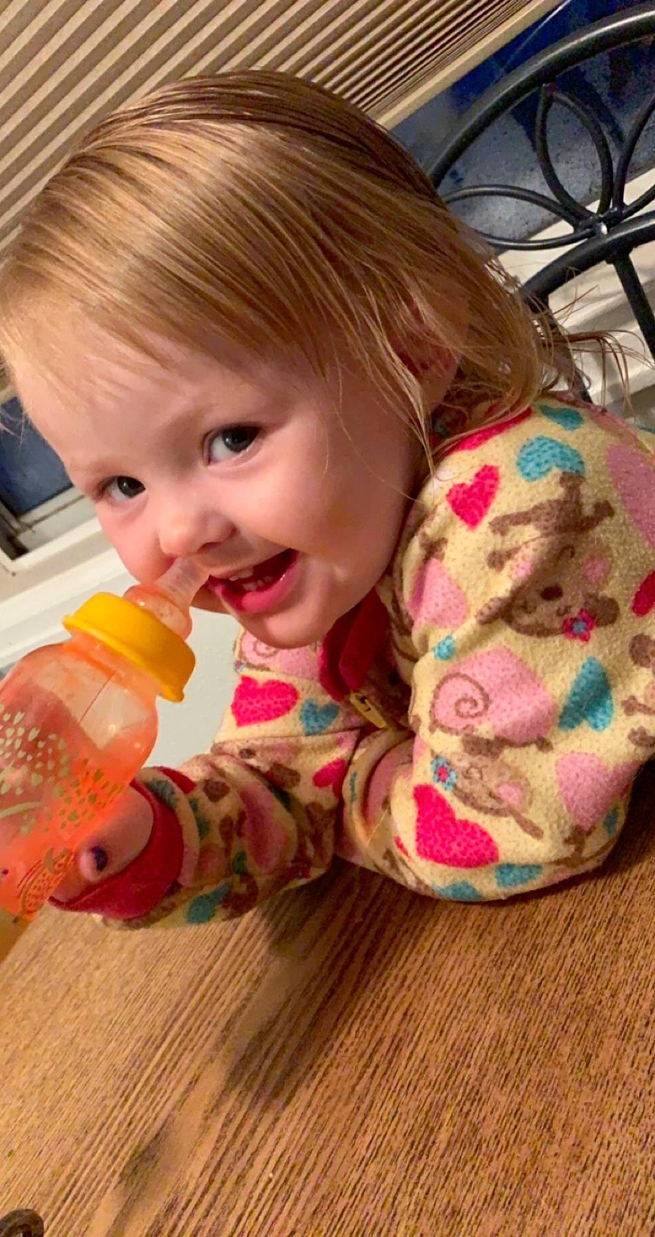 Raeleigh is registered to the contest to win money with this photo: baby, baby_bottle, baby_products, baby_toddler_clothing, bangs, bicycle_tire, bicycle_wheel, bicycle_wheel_rim, bicycles_equipment_and_supplies, blond, bottle, brown_hair, child, drink, drinkware, feathered_hair, hand, person, plastic, plastic_bottle