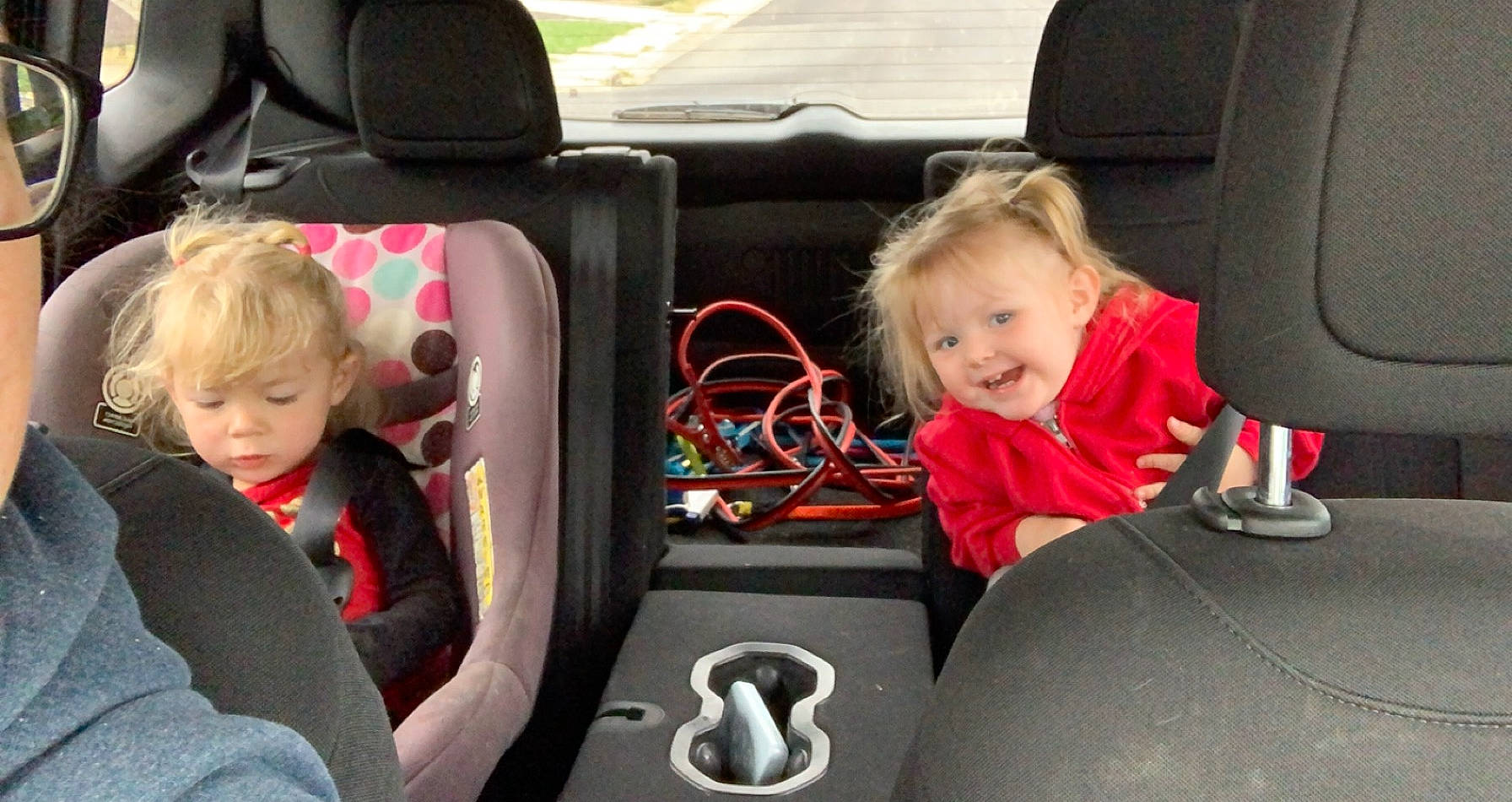 Raeleigh joined the competition — help win amazing prizes! baby, blond, car_seat, car_seat_cover, child, comfort, head_restraint, joy, mode_of_transport, motor_vehicle, person, seat_belt, sitting, steering_wheel, sweater, toddler, vehicle_door