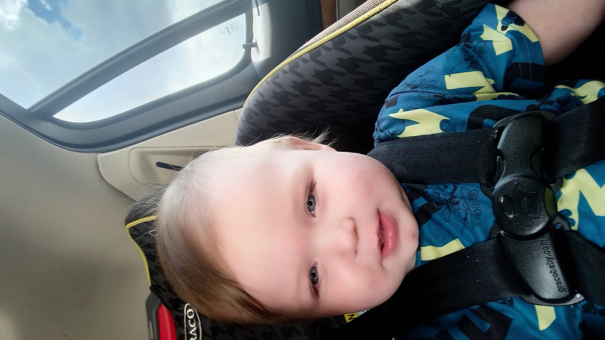 Gareth is registered to the contest to win money with this photo: auto_part, baby, baby_in_car_seat, baby_products, baby_safety, baby_toddler_clothing, car_seat, cheek, child, comfort, electric_blue, person, toddler, vehicle_door, window