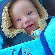 Thiago participe au concours pour gagner de l'argent avec cette photo : baby, child, smiling, blue_eyes, blanket, fleece, pacifier, hood, cozy, warm, infant, cute, portrait, closeup, happy, wrapped, soft, indoor, person, face