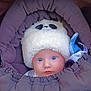 baby, child, blue_eyes, hat, fluffy_hat, panda_design, stroller, purple, blanket, warm_clothing, face, headwear, infant, cute, portrait, baby_clothes, snug, closeup, winter, outdoor