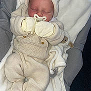 Roman joined the competition — help win amazing prizes! baby, newborn, sleeping, pacifier, knitwear, hat, mittens, blanket, plush_toy, soft_texture, cozy, infant, cute, resting, indoors, child, warm_clothing, portrait, closeup, peaceful