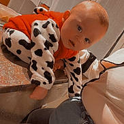 Amaël participe au concours pour gagner de l'argent avec cette photo : baby, casual_clothing, child, countertop, cow_print, crawling, curious, cute, denim, expression, furniture, home, human, indoor, infant, jeans, kitchen, person, portrait, red_vest