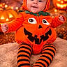 Amaël participe au concours pour gagner de l'argent avec cette photo : baby, celebration, child, costume, cute, face, festive, halloween, happy, holiday, indoors, jack_o_lantern, orange, portrait, pumpkin_costume, sitting, smiling, soft_rug, striped_tights, toddler