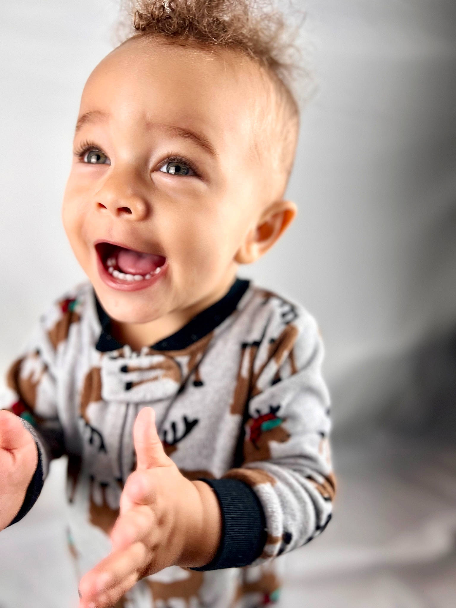 Zeke joined the competition — help win amazing prizes! baby, baby_toddler_clothing, blond, cheek, child, eye, face, flash_photography, fun, gesture, hand, happy, head, person, sitting, skin, sleeve, smile, t_shirt, thumb