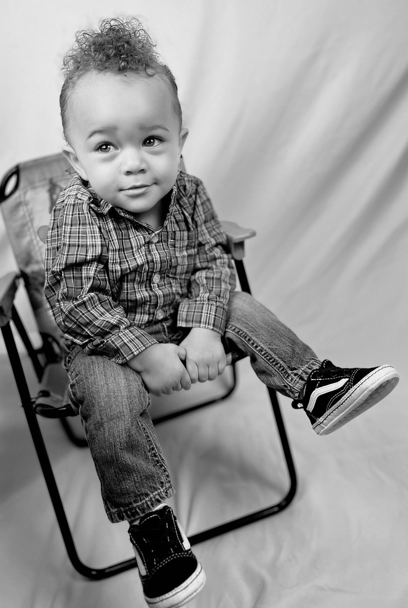 Zeke is registered to the contest to win money with this photo: arm, black_and_white, chair, child, cool, eye, flash_photography, fun, furniture, happy, head, human_body, leg, monochrome, monochrome_photography, person, shoe, shoulder, smile, style
