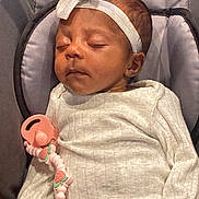 Raya joined the competition — help win amazing prizes! baby, sleeping, headband, bow, white_clothing, pacifier, strawberry, clip, infant, cute, cozy, padded_surface, gray_background, peaceful, child, newborn, resting, soft_texture, indoors, portrait
