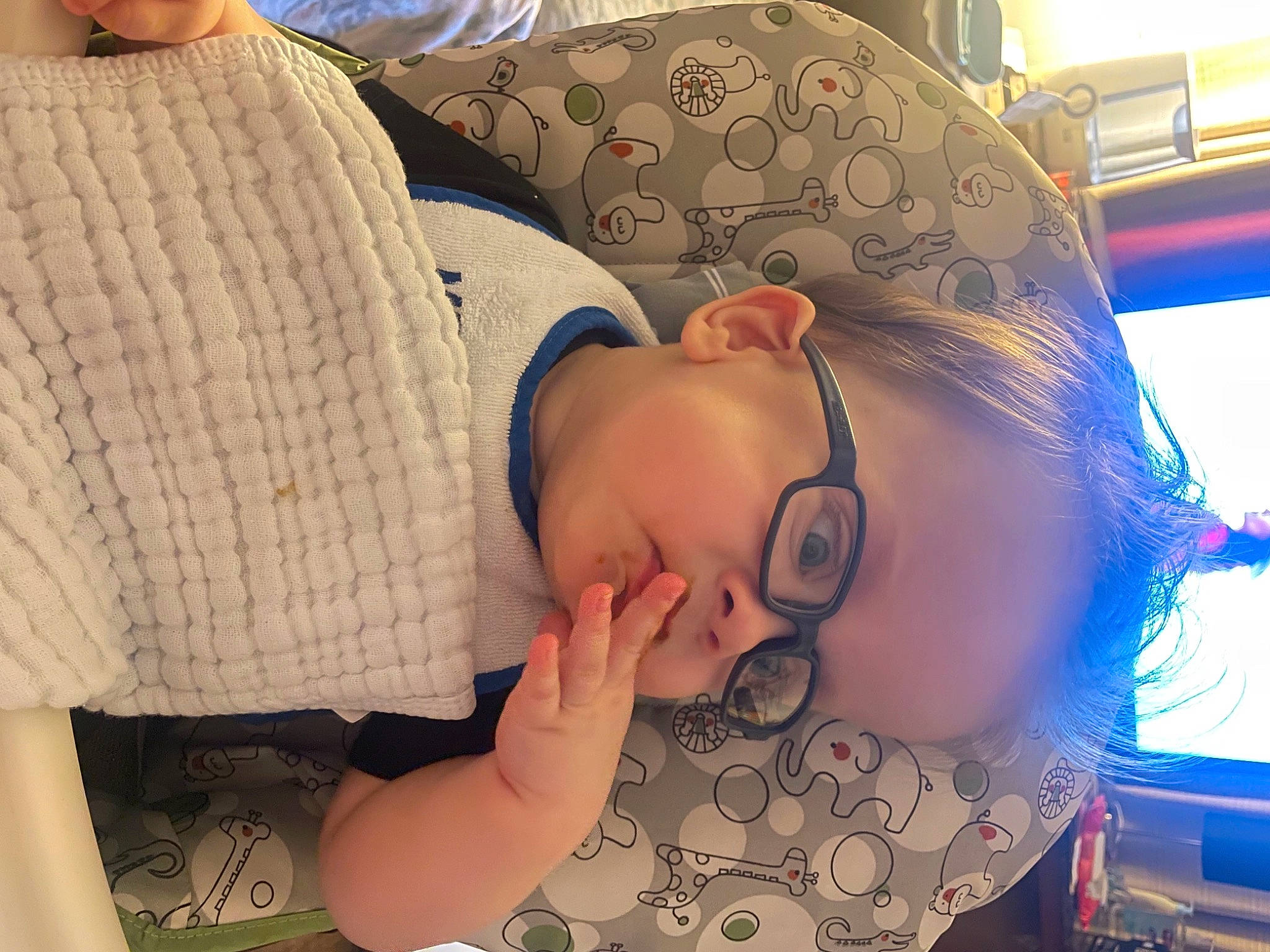Emmett is registered to the contest to win money with this photo: arm, chest, child, comfort, elbow, eyelash, eyewear, finger, glasses, happy, headgear, human_leg, mouth, nail, neck, pattern, person, skin, thigh, trunk