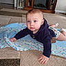 baby, child, blue_eyes, knitted_blanket, carpet, living_room, fireplace, bookshelf, crawling, socks, hoodie, indoor, floor, cute, person, portrait, home, furniture, infant, curious