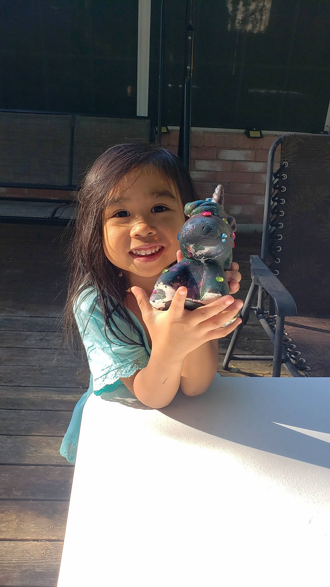 Megan is registered to the contest to win money with this photo: child, gun, joy, person, photography, smile, vacation