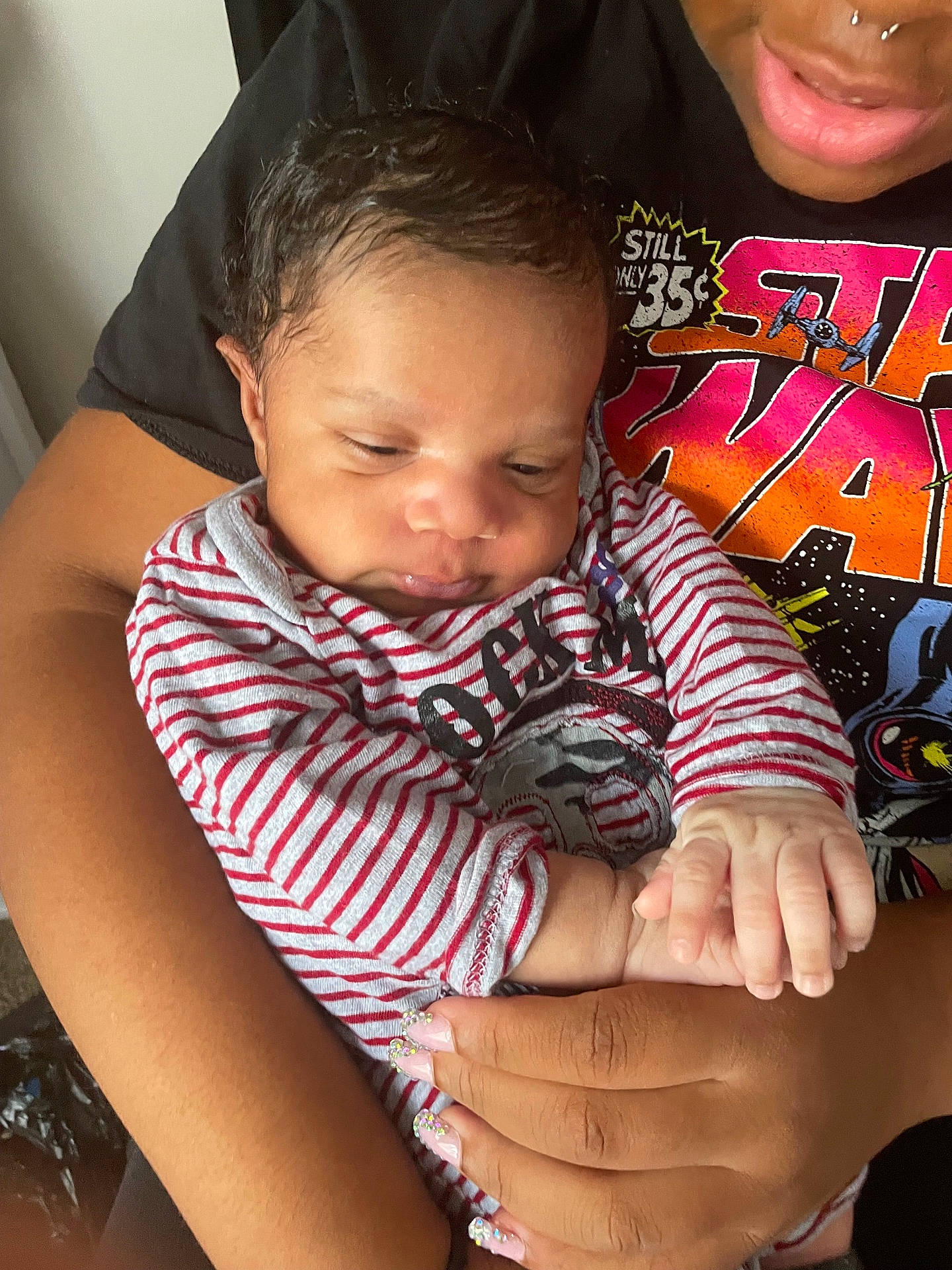 Chigozie is registered to the contest to win money with this photo: accessories, baby, blanket, bodypart, bracelet, clothing, cushion, face, finger, hand, head, hugging, jewelry, newborn, person, photography, portrait, ring, sleeping, t_shirt