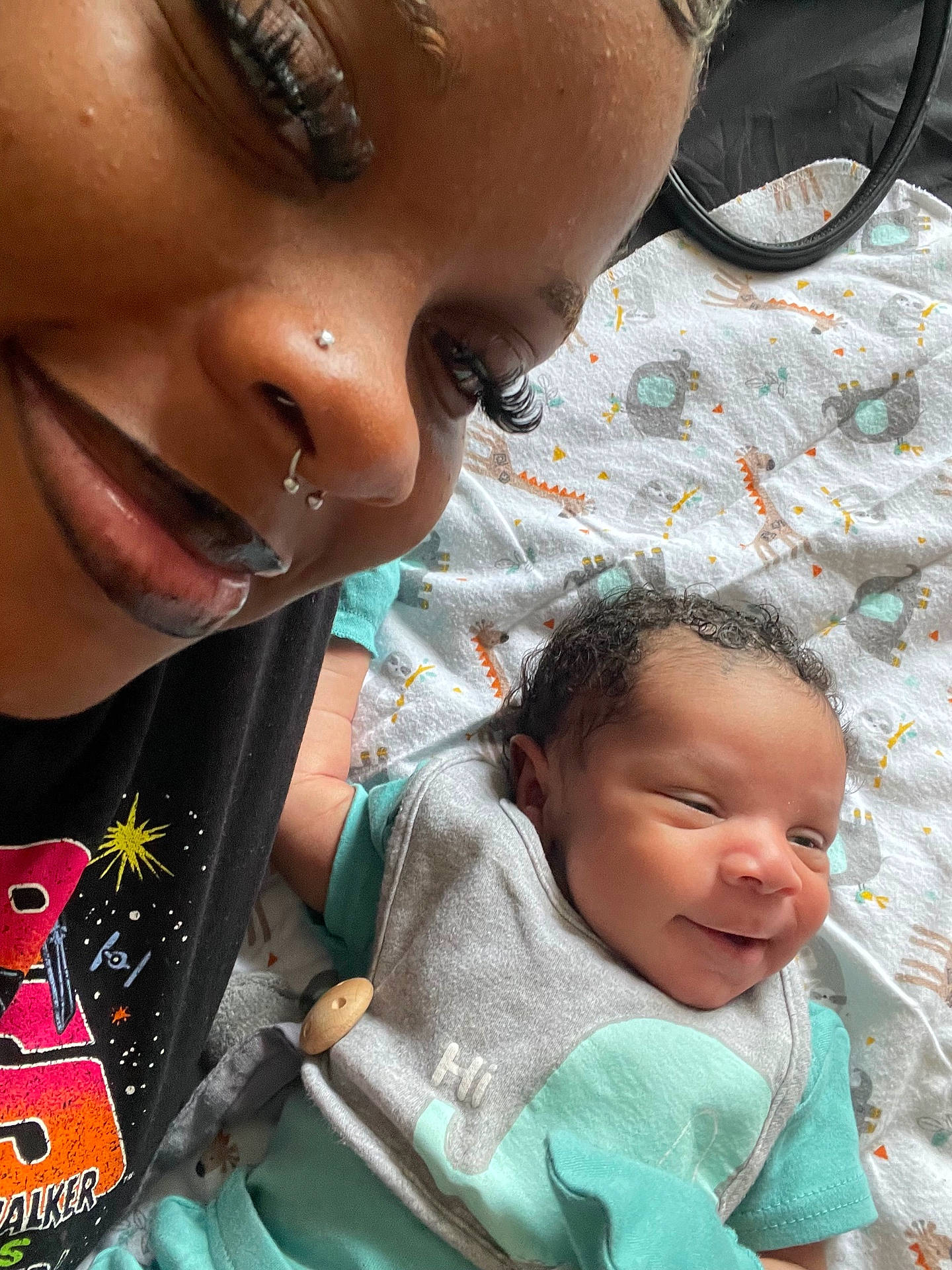 Chigozie is registered to the contest to win money with this photo: accessories, architecture, baby, babylaughing, childbirth, clothing, earring, face, happy, head, jewelry, newborn, person, photography, piercing, portrait, quilt, smile, spitting, t_shirt