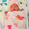 Kamylle is registered to the contest to win money with this photo: newborn, baby, blanket, pink_bow, pacifier, baby_bottle, swaddled, face, sleepy, cute, infant, patterned_blanket, heart_pattern, strawberry_pattern, lying_down, soft_toys, bed, cozy, headwear, colorful