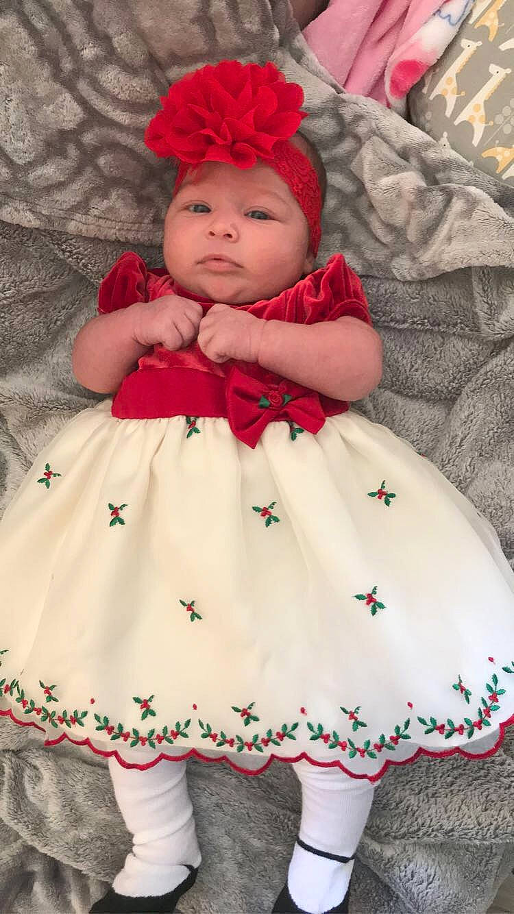 Ellianna is registered to the contest to win money with this photo: baby, baby_toddler_clothing, cheek, child, clothing, day_dress, dress, face, headgear, headwear, lip, magenta, organ, outerwear, person, pink, red, skin, sleeve, textile