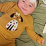 Adalynn joined the competition — help win amazing prizes! baby, child, smiling, headband, flower, yellow_clothing, dog_print, blanket, pattern, lying_down, infant, cute, happy, portrait, face, indoors, person, toddler, apparel, cozy