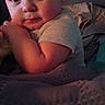 Adalynn is registered to the contest to win money with this photo: baby, child, face, portrait, blanket, indoors, cute, sleepy, cozy, soft_lighting, person, infant, resting, clothing, hands, expression, warm, comfort, young, closeup