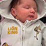 baby, sleeping, hoodie, lion_king, cartoon, zipper, clothing, infant, cute, child, face, head, pink, white, black, blanket, portrait, soft, peaceful, young