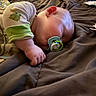 baby, sleeping, pacifier, pajamas, bed, blanket, infant, child, cozy, soft, hand, face, cute, rest, nap, indoors, fabric, closeup, comfort, peaceful