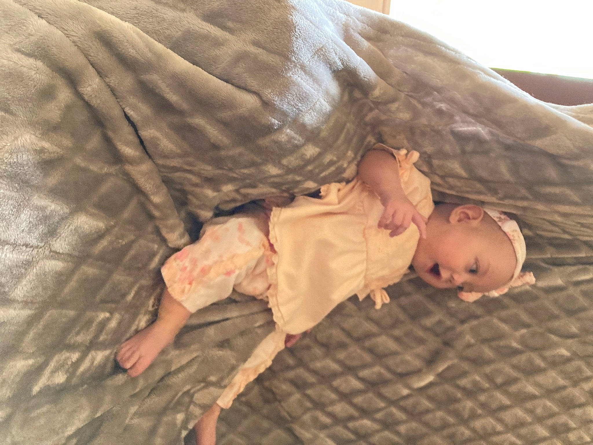Charlotte joined the competition — help win amazing prizes! baby, baby_toddler_clothing, bed, child, comfort, elbow, finger, flooring, foot, gesture, hardwood, human_body, linens, mammal, military_camouflage, pattern, person, skin, sleeve, toddler