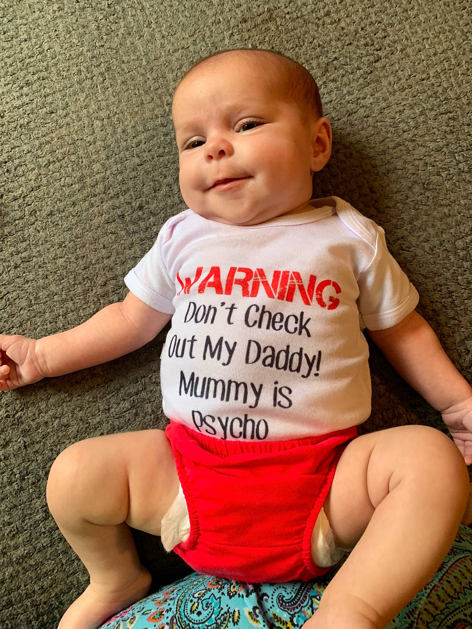 Emilee joined the competition — help win amazing prizes! baby, baby_products, baby_toddler_clothing, cheek, child, joy, person, product, sitting, sleeve, t_shirt, toddler