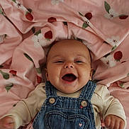 Autumn joined the competition — help win amazing prizes! baby, smiling, denim_overalls, pink_blanket, strawberry_pattern, flower_pattern, infant, happy, face, cute, clothing, lying_down, child, soft_texture, indoor, portrait, young, cheerful, baby_girl, baby_boy