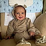 baby, bear_ears, blanket, blue_eyes, chair, child, comfortable, cozy, cushion, cute, happy, hood, indoor, infant, newborn, onesie, portrait, smiling, soft_toys, towel