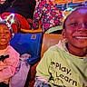Devon is registered to the contest to win money with this photo: children, smiling, stadium, seats, indoor, portrait, siblings, young, toddler, girl, boy, light_up_headband, colorful, flowers, clothing, pink, green, play, learn, audience