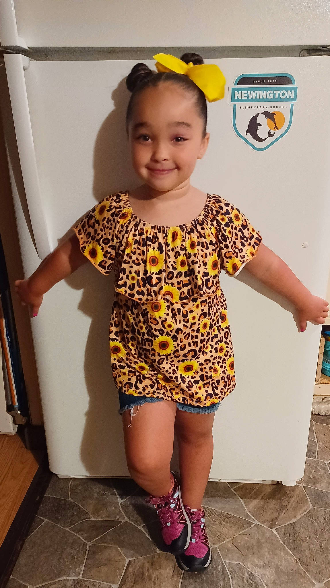 Madalyn is registered to the contest to win money with this photo: baby_toddler_clothing, child, clothing, fashion_accessory, fun, hairstyle, happy, human_leg, joint, joy, knee, pattern, person, photograph, sleeve, smile, snapshot, standing, t_shirt, thigh