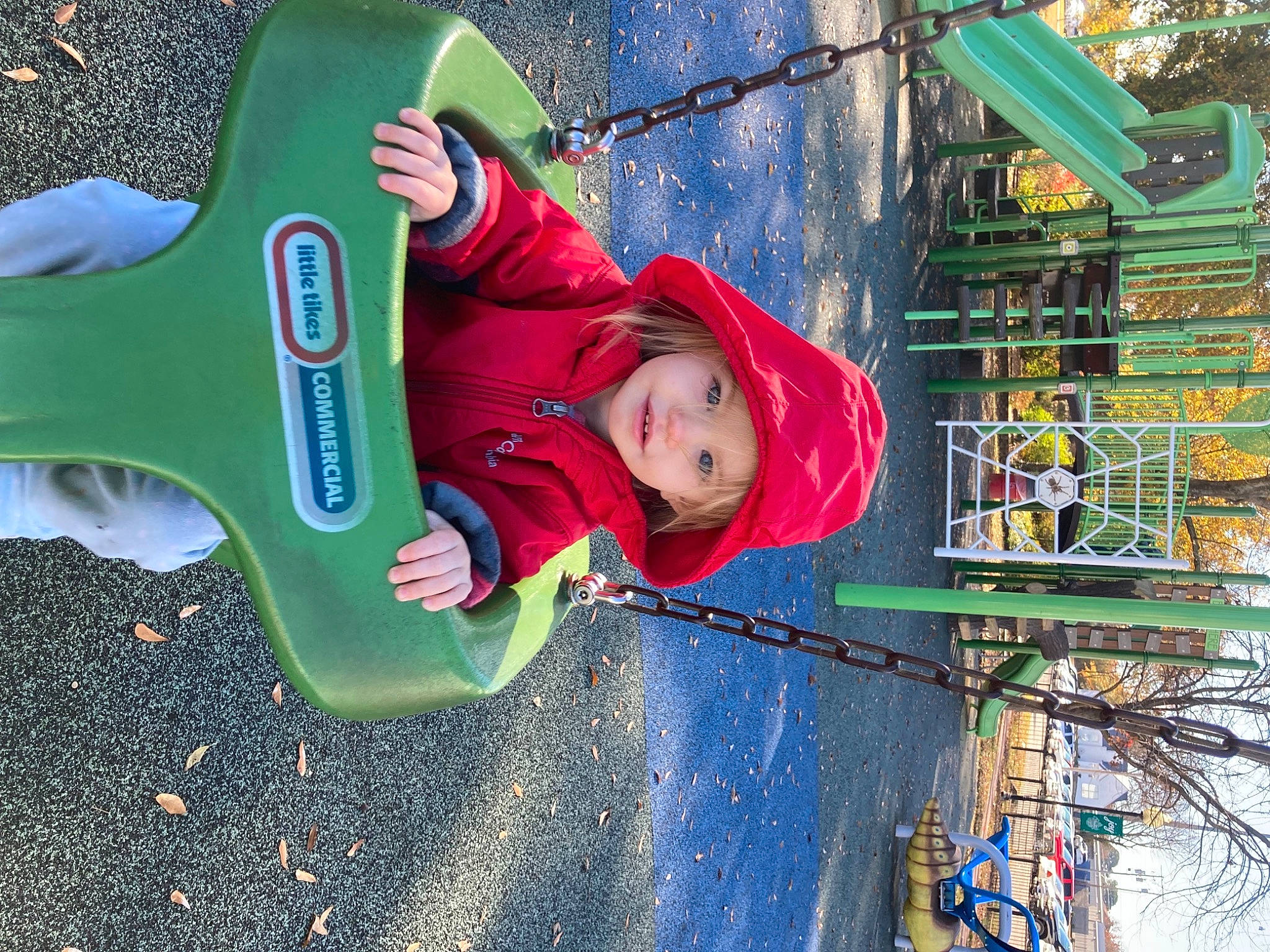 Azlynn is registered to the contest to win money with this photo: child, chute, city, electric_blue, fun, grass, green, headwear, leaf, leisure, magenta, outdoor_play_equipment, person, play, playground, public_space, recreation, shadow, toddler, tree