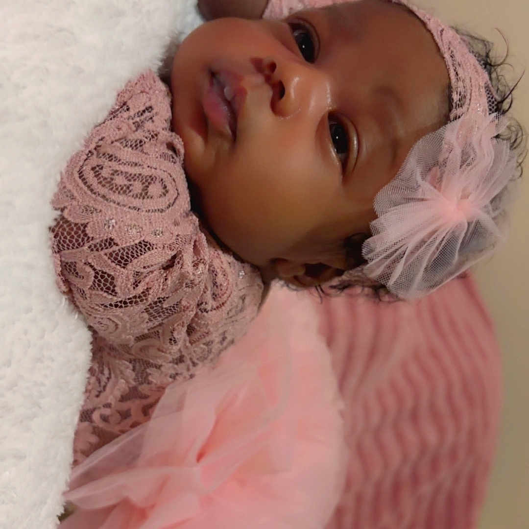 Juliet joined the competition — help win amazing prizes! baby, infant, child, pink, lace, headband, tulle, dress, cute, portrait, lying_down, blanket, soft, indoors, sleepwear, adorable, young, newborn, face, person