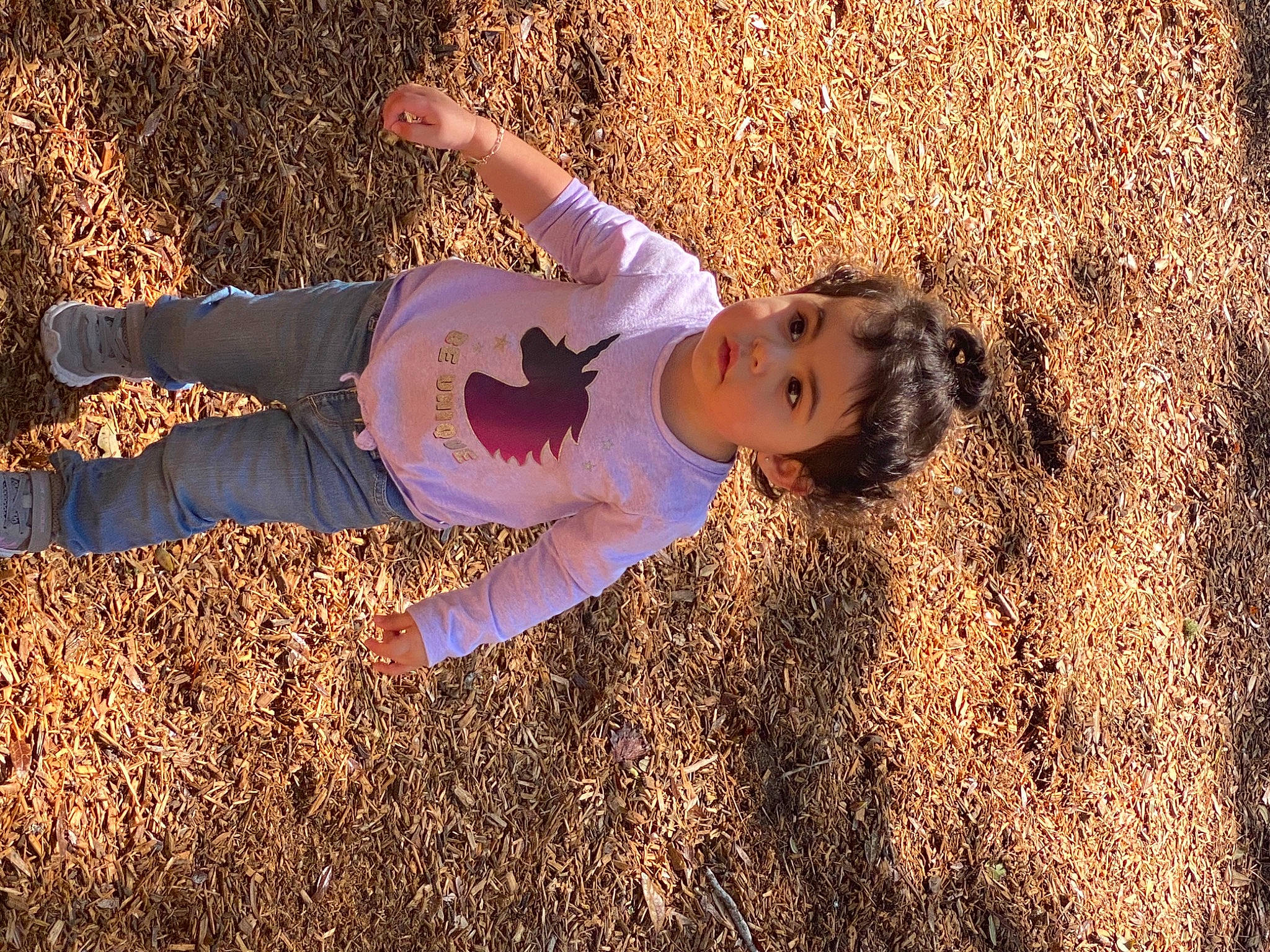 Katherine is registered to the contest to win money with this photo: blond, boot, child, field, fun, grass, grassland, happy, human_leg, landscape, leisure, people_in_nature, person, plant, prairie, shadow, sky, soil, straw, sunlight