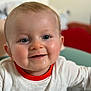 Raphaël participe au concours pour gagner de l'argent avec cette photo : baby, child, smiling, face, blue_eyes, white_shirt, red_collar, indoor, close_up, cheerful, happy, cute, infant, portrait, sitting, skin, head, person, young_child, expression