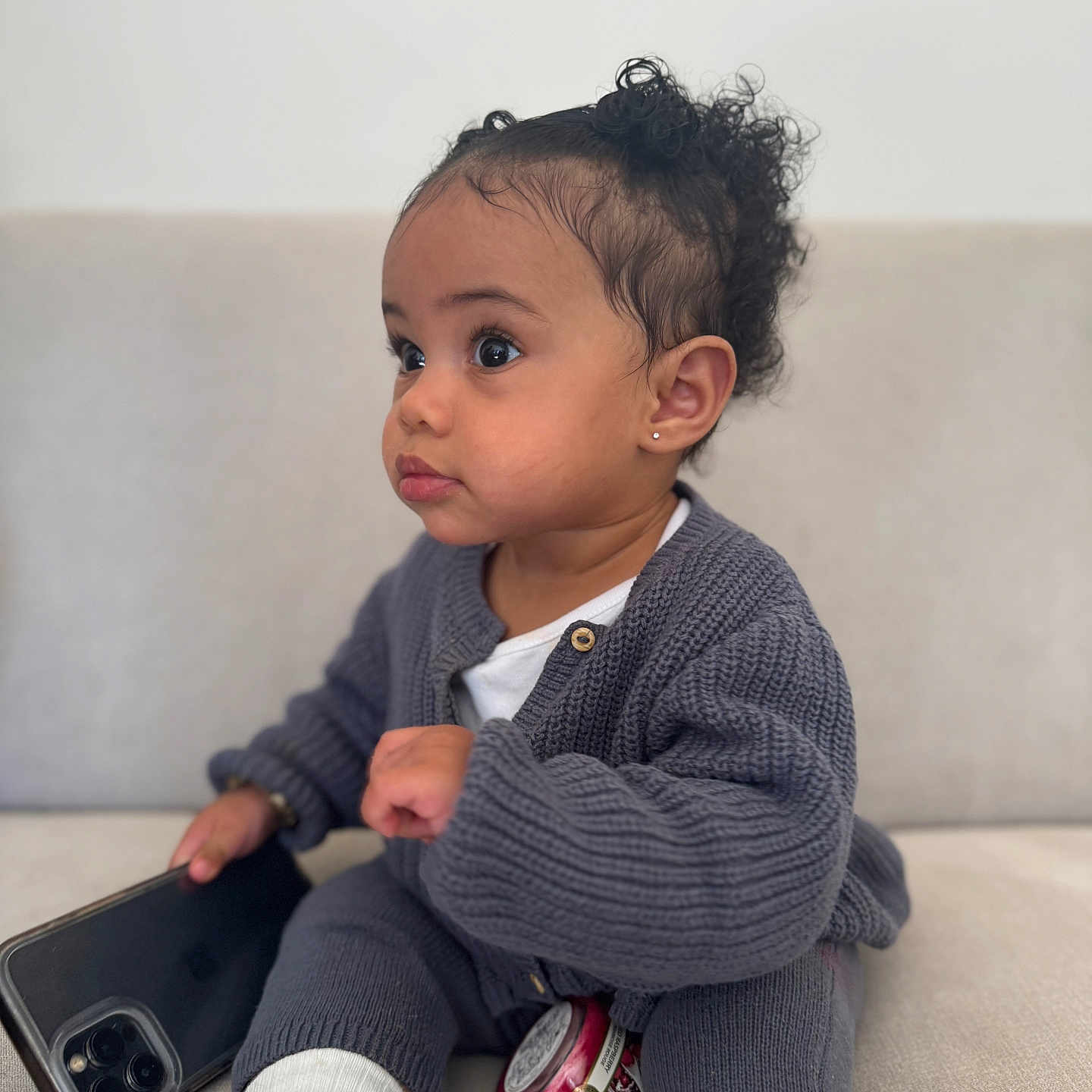 Ariya joined the competition — help win amazing prizes! baby, bodypart, can, clothing, couch, face, finger, footwear, furniture, hand, happy, head, knitwear, person, photography, portrait, shoe, sitting, smile, sweater