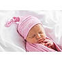 newborn, baby, sleeping, pink_hat, pink_blanket, infant, soft_texture, white_background, closeup, peaceful, wrapped, cute, child, portrait, resting, adorable, blanket, hat, newborn_photography, soft_lighting