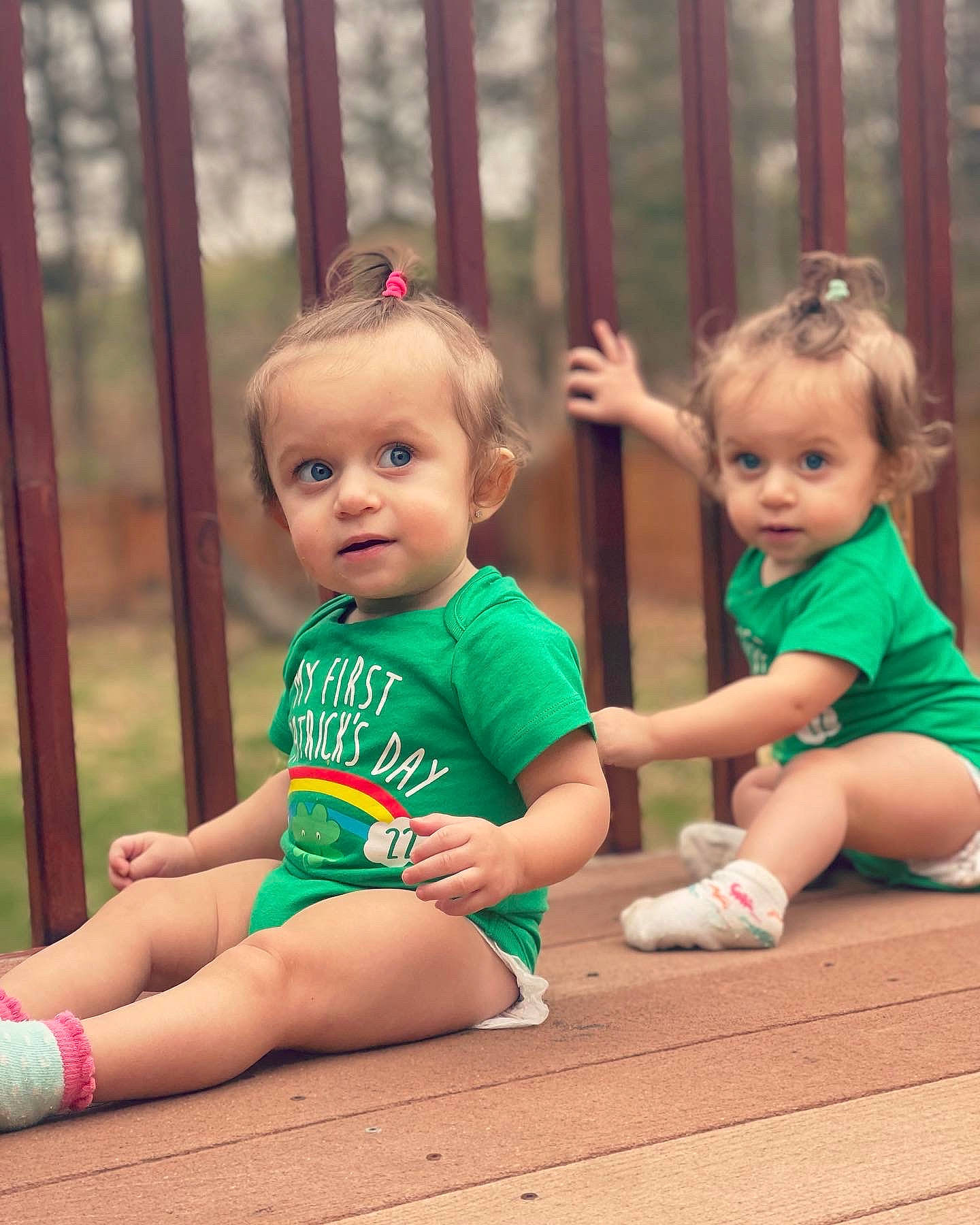 Maya is registered to the contest to win money with this photo: baby, baby_toddler_clothing, child, eye, face, finger, grass, hair, happy, head, joint, leg, leisure, people_in_nature, person, pink, recreation, shoe, skin, toddler