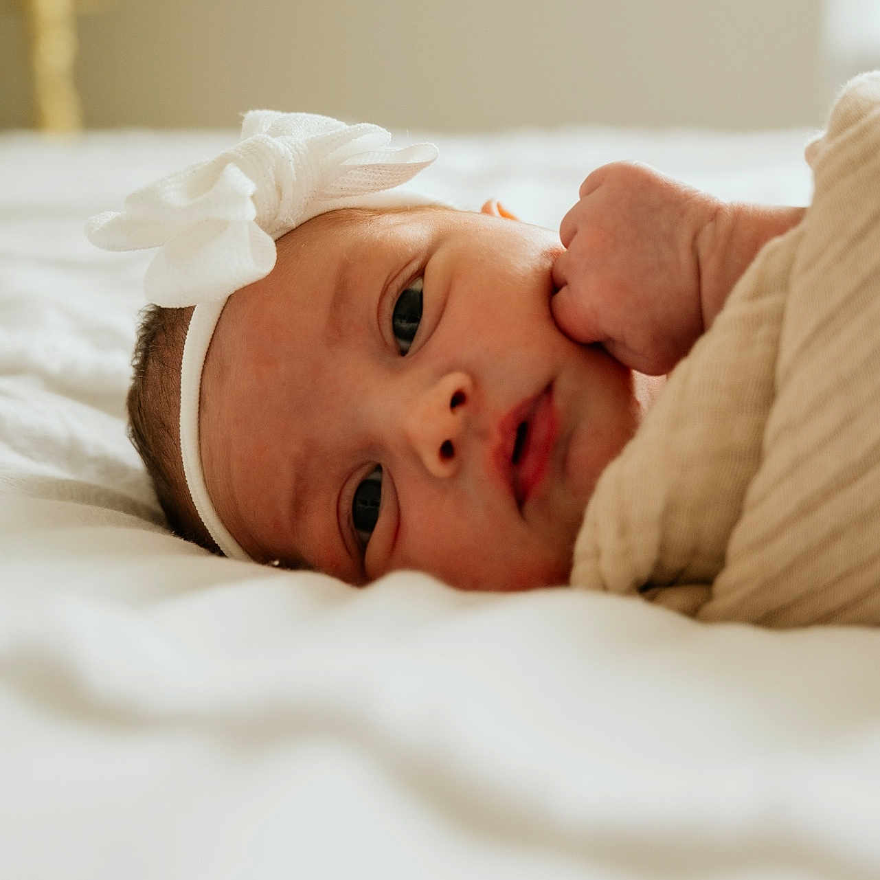 Eveana joined the competition — help win amazing prizes! baby, bed, blanket, bow, child, cozy, cute, expression, face, hand, headband, indoors, infant, newborn, person, portrait, skin, sleeping, soft, young